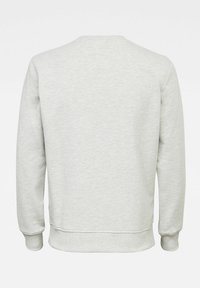 Felpa grigia chiara, texture morbida, design con scollo rotondo, polsini e orlo a coste, dettagli minimi, vista posteriore, nessuna grafica o decorazione visibile.