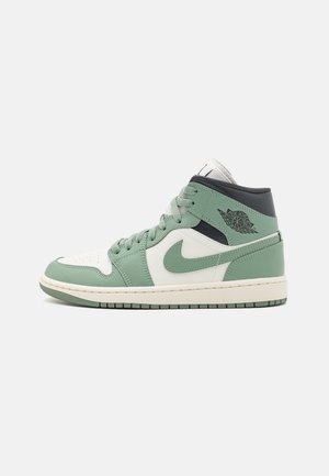 High-top sneakers featuring a mint green leather upper, white accents, padded collar, and a rubber sole with a textured tread pattern.