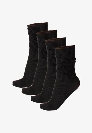 Calzini neri a coste mostrati in un gruppo di quattro, con un design testurizzato e un risvolto nella parte superiore.