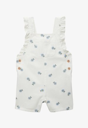 Combinaison blanche pour tout-petit avec bretelles volantées, poche poitrine devant, boutons latéraux et petit imprimé floral marguerite bleue partout.