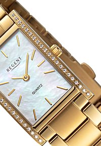 Montre en quartz doré avec un cadran rectangulaire en nacre, indices en or et accents en cristal le long de la lunette. Bracelet en métal.
