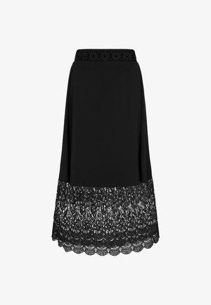 Black skirt with a lace hemline featuring a scalloped edge. The waistband has a floral design, made from a blend of fabric and lace.