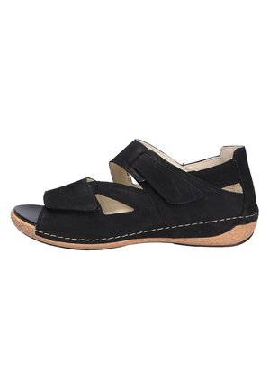 Black sandal with suede upper, dual Velcro straps, open toe design, and a contoured cork sole with stitched accent.