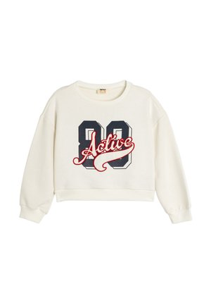 Kremowy, krótki sweter z opadającymi ramionami, z dużym granatowym napisem "88" oraz czerwonym "Active" z przodu. Wykonany z miękkiej mieszanki bawełny.