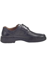 Sorte læderherresko med rund tå, syede detaljer og gummisål. Har en glat overflade og slip-on design.