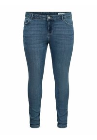 Õhukese lõikega sinised teksapüksid viie taskuga, kergelt kulunud ja kinnitatavad nööpidega. Kangas on pehme tekstuuriga ja veidi veniv.