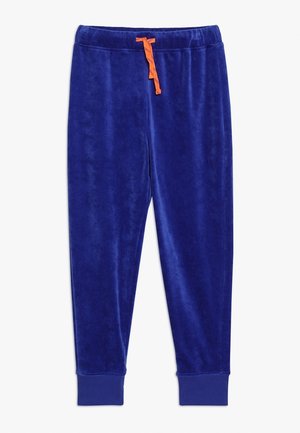 Blå velour joggingbukser med elastisk talje og orange snøre, ribstrikkede manchetter ved anklerne.