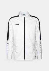 Witte sportjack met zwarte accenten, volledige rits, hoge kraag, JAKO-logo en knoopdetails op de mouwen. Slim fit en een gladde textuur.