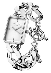 Reloj de eslabones de plata con una esfera rectangular blanca, que cuenta con una caja octogonal y un cierre de toggles. Manecillas del hora y minuto delgadas.