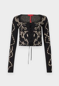 Pull court noir à manches longues avec motif serpent beige et détail à lacets à l'avant. Encolure carrée et coupe ajustée.