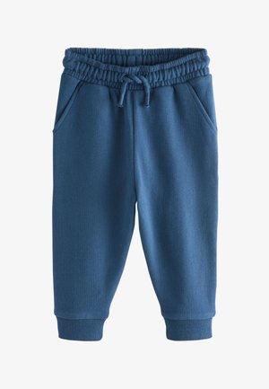 Blå bomulds-sweatpants med elastik i taljen, snøre, to sidelommer og ribstrikkede manchetter ved anklerne. Blød tekstur, enkelt design.