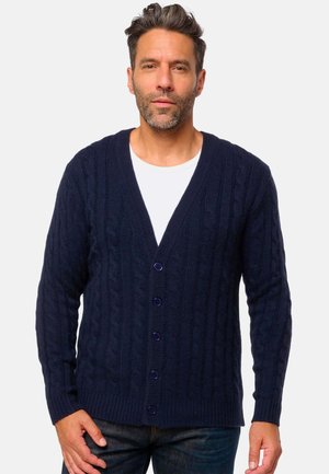 Cardigan en tricot côtelé bleu marine avec un col en V, des boutons sur le devant et des bords côtelés, fabriqué à partir d'un fil texturé épais.