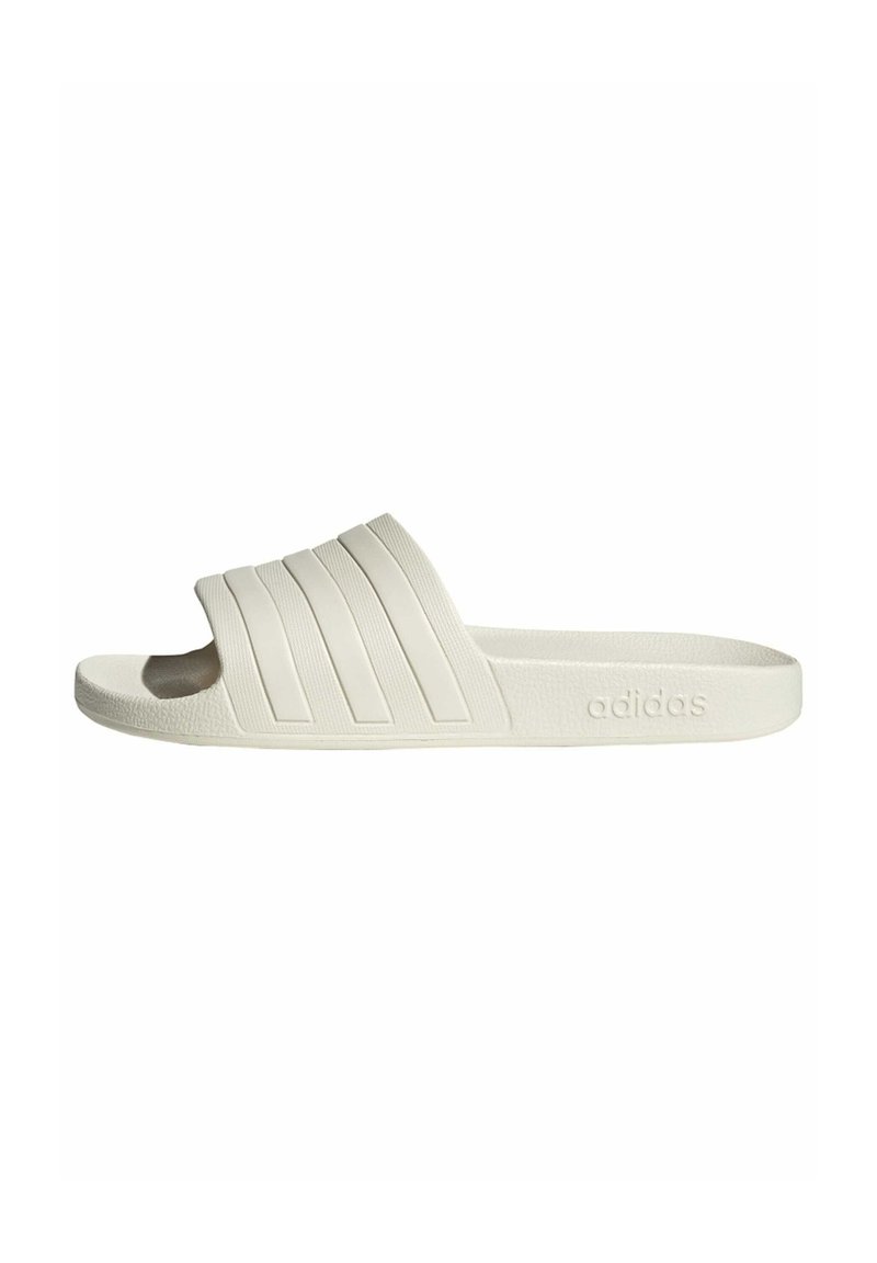 White slide sandal with a textured rubber sole, featuring three horizontal striped accents on the upper and the adidas logo embossed on the side.