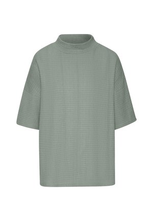 Übergröße Kurzarm-Oberteil aus weichem, strukturiertem hellgrünem Stoff mit hohem Halsausschnitt und lässigem Schnitt. Einfaches Design, nahtlose Verarbeitung.