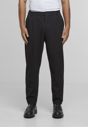 - Spodnie materiałowe