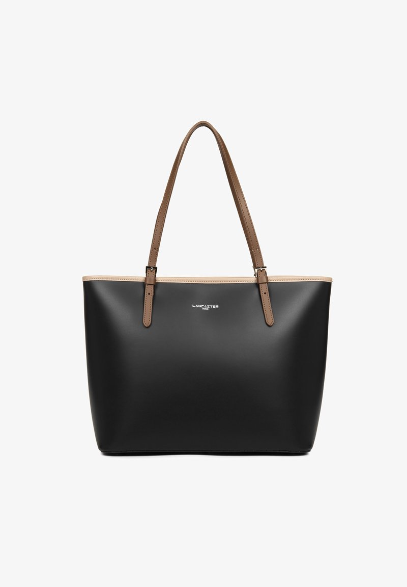 Sac fourre-tout noir en matériau lisse, avec des poignées en cuir marron et un bord supérieur beige contrastant. Présente un logo sur le devant.