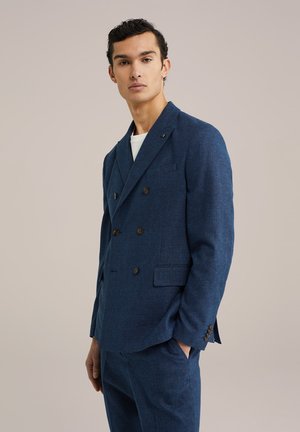 Double-breasted blue blazer with textured fabric, featuring notched lapels, two front pockets, and brown buttons. Tailored fit design.