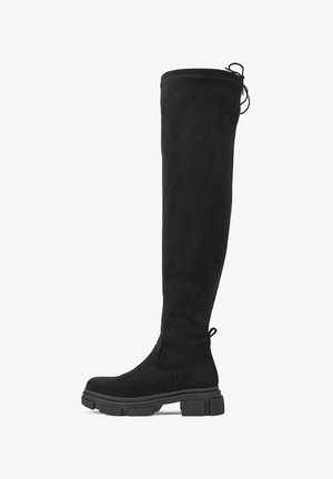 Czarny kozaki za kolano z masywną podeszwą i pętelką z tyłu, z ozdobnym sznurowaniem na górnej krawędzi z tyłu.