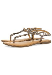 Sandalias planas de color bronce con acentos de cadena trenzada, tiras delgadas y una plantilla suave de color marrón claro. Hebilla ajustable en el tobillo para un mejor ajuste.