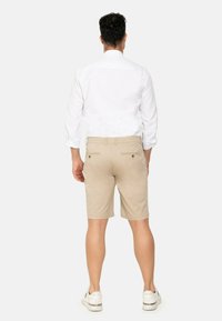 EMBLEMS BERMUDA - Shorts - beige