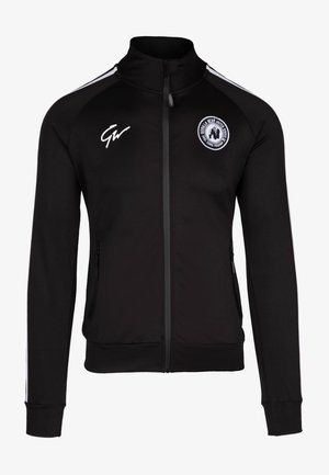 Zwarte ritsjack met hoge kraag, voorzien van witte zijstrepen en logo op de linkerborst, gemaakt van een gladde, rekbare stof.