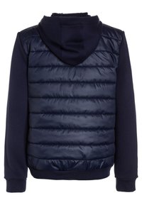 Mörkblå hoodie-jacka med en pösig, vadderad front och släta ärmar, designad för värme med elastiska ärmslut och midja.