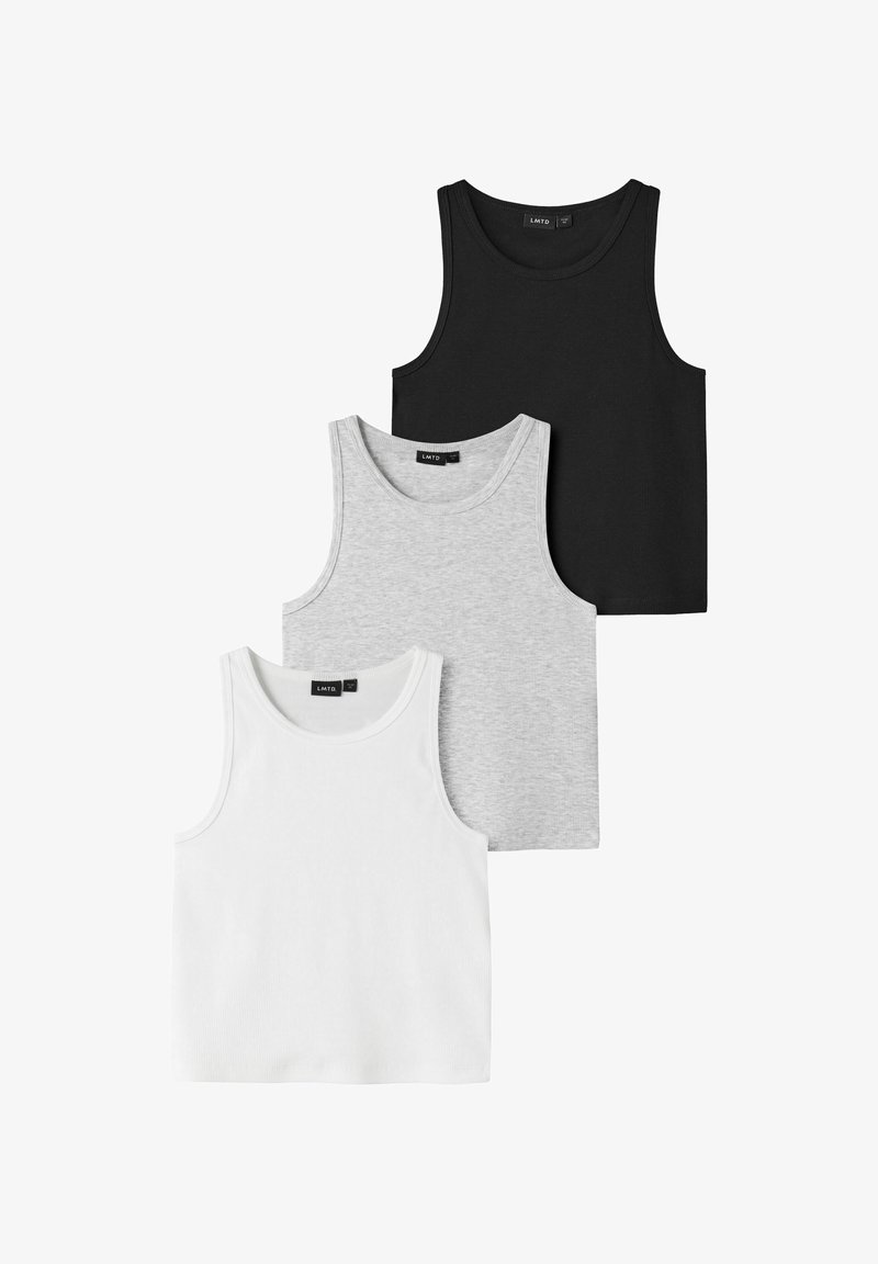 Trois débardeurs côtelés sans manches en noir, gris et blanc, disposés en chevauchement sur un fond blanc.