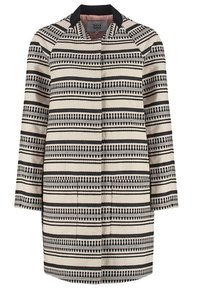 Cappotto alla lunghezza del ginocchio realizzato in tessuto beige con motivi a righe nere verticali e orizzontali. Presenta un colletto e maniche lunghe.