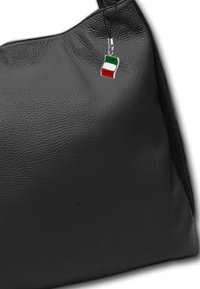 Black leather handbag with a textured surface. Features a small charm shaped like the Italian flag attached to the strap.
