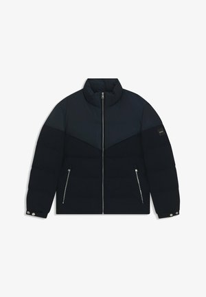 Marineblau gepolsterte Jacke mit hohem Kragen, Reißverschluss und zwei Seitentaschen. Verfügt über ein kontrastierendes Paneeldesign und silberne Hardware-Details.