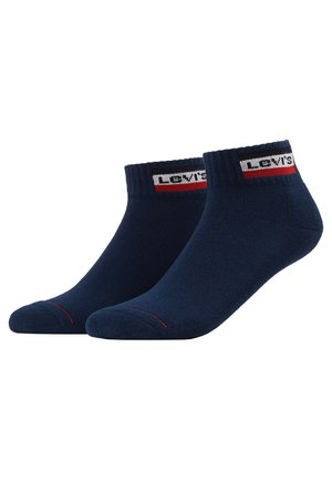 Navy blue cotton socks with a ribbed cuff, featuring a white and red Levi's logo band and a contrasting red stripe at the toe.