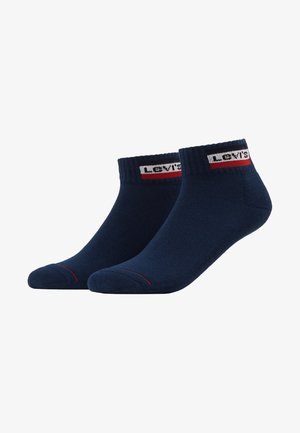 Meias de algodão azul-escuro com punho canelado, apresentando uma faixa com o logótipo branco e vermelho da Levi's e uma risca vermelha contrastante na ponta.