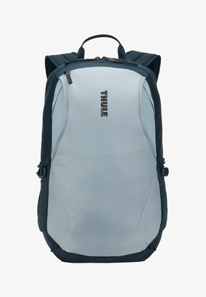 Sac à dos Thule gris et noir avec poignée supérieure, bretelles rembourrées et compartiments fermés par zip.