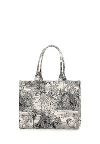 Sac fourre-tout en toile avec un motif de tigre monochrome et de jungle, noir sur fond blanc, doté de deux poignées supérieures et d'un design structuré.