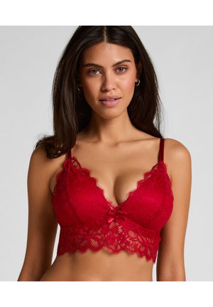 Rode kanten bralette met bloemmotieven, een getand decolleté, verstelbare bandjes en een klein strikje in het midden.