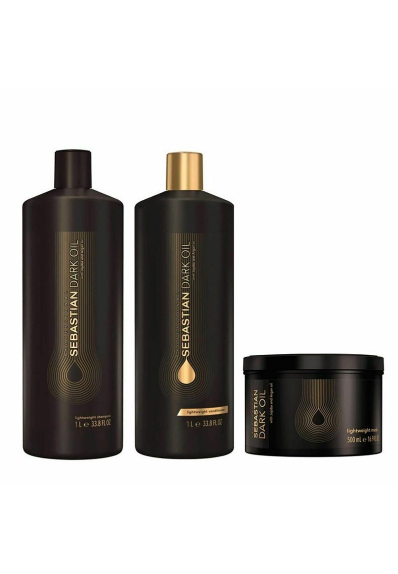 Three black bottles of hair care products: a shampoo and conditioner with gold accents, and a smaller black jar labeled "lightweight mask."