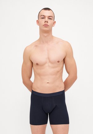 Marineblaue Baumwoll-Boxershorts mit einem elastischen Bund in Markenqualität, ausgestattet mit einer taillierten Form und glatter Textur.