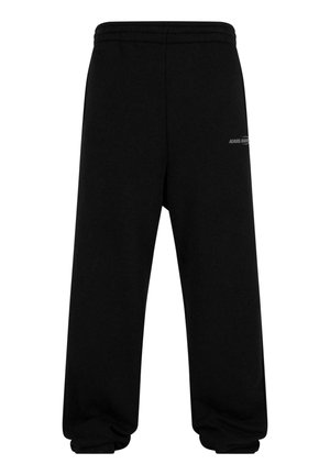 Black sweatpants made of cotton blend with a wide leg design, elastic waistband, and a subtle logo detail on the left hip.