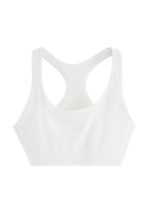 White sports bra featuring a ribbed texture, wide racerback design, and a smooth silhouette. Fabric is stretchy and soft.