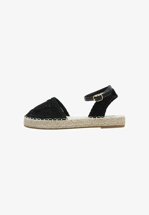 Sandale espadrille tissée noire avec sangle de cheville ajustable, semelle plateforme en jute et empeigne texturée. Détails de couture le long des bords.
