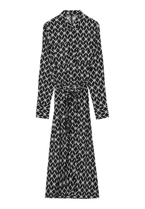 Black and white patterned dress featuring a collared neck, long sleeves, button-down front, and a tied waist belt. Long, flowing silhouette.