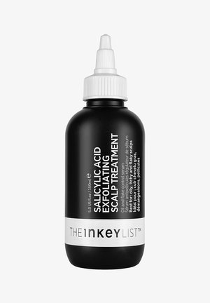 Schwarze Flasche mit einem weißen Druckverschluss. Das Etikett zeigt weißen Text mit der Aufschrift "Salicylsäure Peelingbehandlung für die Kopfhaut" und das Markenlogo.