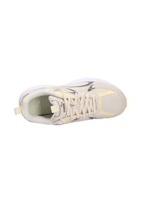 Beige athletic shoe with mesh and synthetic materials, featuring tonal accents, a lace-up design, and a padded collar for comfort.