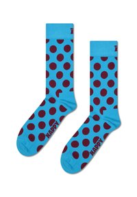 Niebieskie skarpetki w dużą bordową kropkę. Posiadają jednolitą niebieską mankietkę oraz logo na podeszwie. Wykonane z miękkiego, elastycznego materiału.