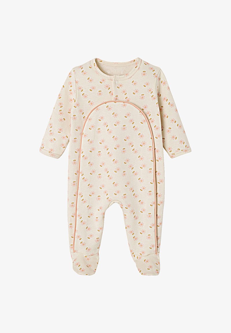 Long-sleeve onesie in soft beige fabric with small floral print. Features a rounded neckline and snap fasteners along the front.