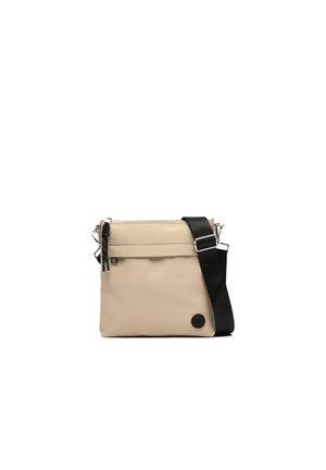 Beige crossbody bag made of textured synthetic material. Features a zippered top, black detachable strap, and a front pocket with hardware accents.