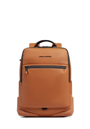 Tan leather rectangular backpack with black zipper pocket, top handle, and padded shoulder straps, front-facing on white background.