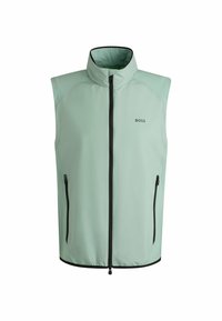 Hellgrüne ärmellose Weste mit hohem Kragen, schwarzem Reißverschluss und Taschen, hergestellt aus glattem Stoff. Verfügt über eine minimalistische Markenkennzeichnung auf der Vorderseite.