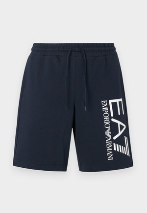 Tmavomodré bavlnené šortky s elastickým pásom a sťahovacou šnúrkou. Na ľavej strane je potlačené biele logo a textový dizajn.