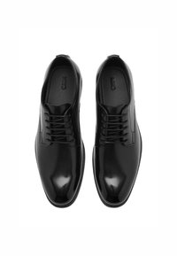 Schwarze Lederschuhe mit einer glatten, glänzenden Oberfläche. Sie verfügen über fünf Ösen für die Schnürsenkel, eine abgerundete Spitze und dezente Nähdetails.
